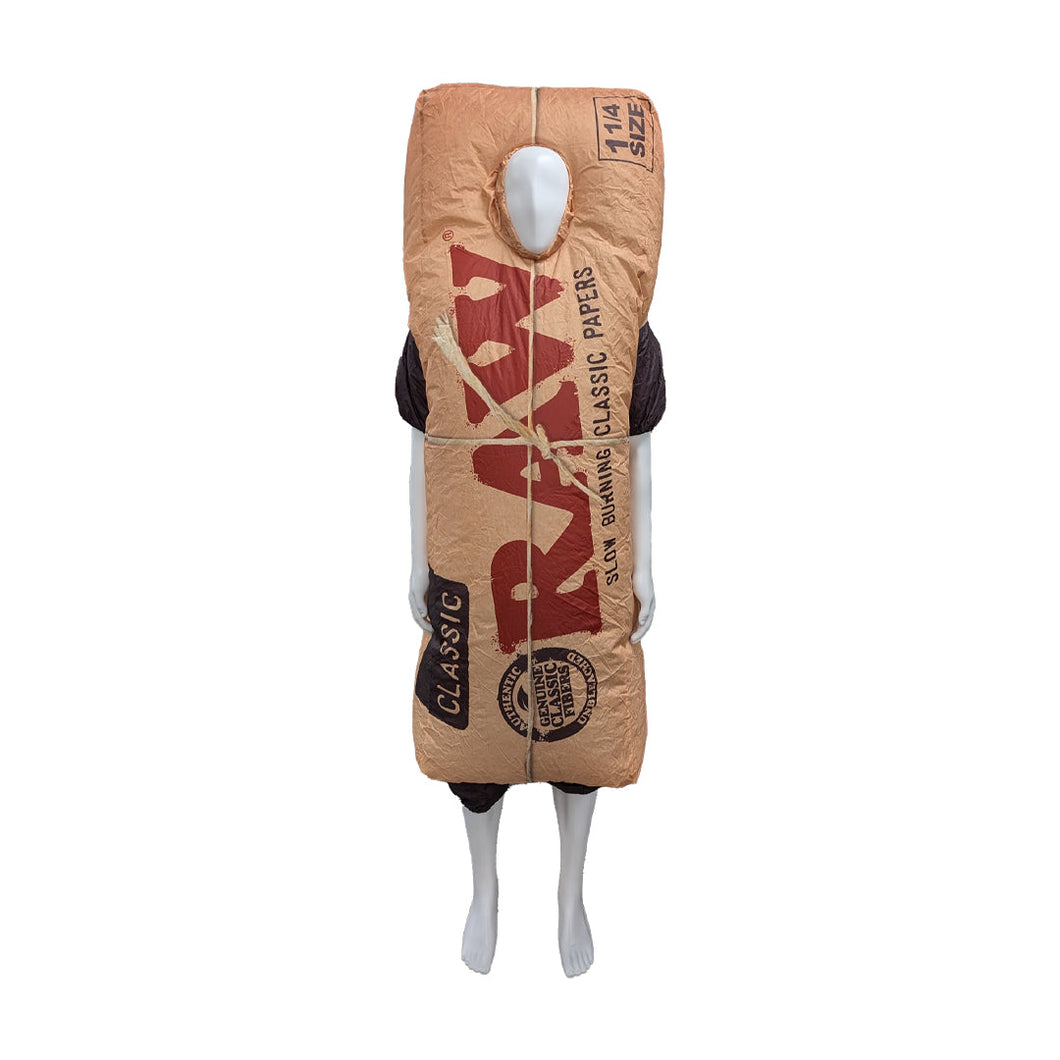 Someone wears the RAW Packy Inflatable Costume, designed to look like a giant RAW rolling paper pack with bold branding and a face opening, covering from shoulders to knees for a fun and eye-catching outfit.