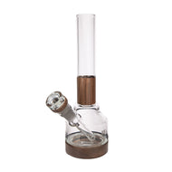 The MJ Arsenal Alpine Series - Palisade Bong features a clear glass body, cylindrical neck, wooden accents at the base and joint, and a slanted side bowl, showcasing modular design inspired by its Palisade Water Pipe lineage.