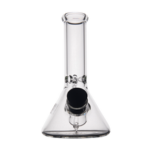 The MJ Arsenal Cache Bong is a clear borosilicate glass beaker with a cylindrical neck, featuring a black mouthpiece and bowl, shown on a plain white background.