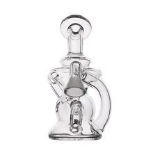 The MJ Arsenal Hydra Vape Edition is a clear, intricately designed glass water pipe with multiple curves and chambers, featuring a splash-resistant bubbler for smoother sessions, shown standing upright against a plain white background.