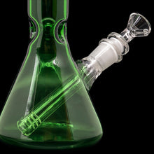 A close-up of the "Crown Jewel" Emerald Green Beaker Bong by LA Pipes, featuring a clear glass downstem and bowl, set against a black background. Handmade in Los Angeles from borosilicate glass.