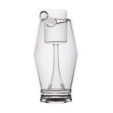 The MJ Arsenal Proxy Bubbler is a clear borosilicate glass water pipe with a modern geometric design, featuring a cylindrical mouthpiece, central chamber, and stable round base—perfect for dabbing—displayed on a plain white background.