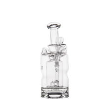 The MJ Arsenal Turbine Mini Dab Rig is a clear borosilicate glass water pipe with a cylindrical base, multiple chambers, a vertical mouthpiece, and an Inception Turbine Perc, shown against a plain white background.