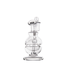 The MJ Arsenal Royale Mini Dab Rig is a clear borosilicate glass piece featuring a rounded base, curved neck, and intricate fab egg percolator, presented against a plain white background.