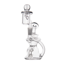 The MJ Arsenal Hydra Mini Dab Rig, a clear glass water pipe with a rounded base, side handle, and integrated chamber and mouthpiece, is displayed against a plain white background.