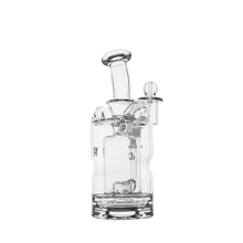 The MJ Arsenal Turbine Mini Dab Rig is a clear borosilicate glass water pipe with a cylindrical base, multiple chambers, an angled mouthpiece, side attachment, intricate internal glasswork, and the signature Inception Turbine Perc for smooth filtration.