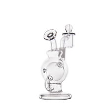 The MJ Arsenal Atlas Mini Dab Rig is a compact, clear borosilicate glass piece with a round base, curved neck, side tube attachment, circular mouthpiece, and cylindrical chamber displayed on a white background.