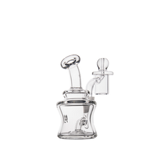 The MJ Arsenal Jammer Mini Dab Rig, made of clear borosilicate glass with a curved neck, cylindrical chamber, fixed downstem, and removable bowl attachment, is displayed on a white background.