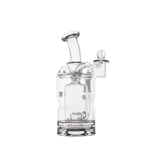 The MJ Arsenal Turbine Mini Dab Rig is a clear borosilicate glass water pipe featuring a curved neck, cylindrical base, and removable bowl, shown against a plain white background.