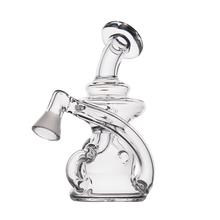 The MJ Arsenal Hydra Vape Edition is a clear, intricately designed glass water pipe featuring a curved neck, angled mouthpiece, and splash-resistant bubbler side chamber, shown against a plain white background.