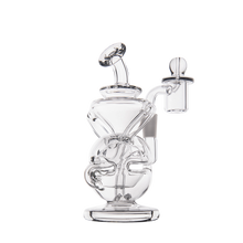 The MJ Arsenal Infinity Mini Dab Rig, made from clear borosilicate glass, features intricate curved tubing and a side-mounted bowl, displayed against a plain white background.