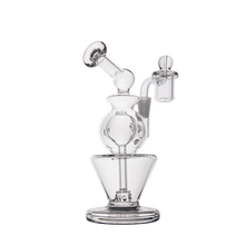The MJ Arsenal Gemini Mini Dab Rig is a clear borosilicate glass rig with a round base, curved neck, and attached bowl for vaporizing concentrates. This portable dab rig is shown on a white background.