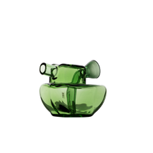 The MJ Arsenal Commander Blunt Bubbler is a modern, transparent green borosilicate glass piece with a unique asymmetrical design featuring an angled, elongated neck and rounded base, shown against a plain white background.