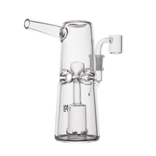 The MJ Arsenal Turret Mini Dab Rig features clear borosilicate glass, a cylindrical body, angled mouthpiece, central percolator, and detachable bowl—all in a compact, portable design shown on a white background.