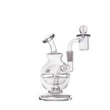 The MJ Arsenal Royale Mini Dab Rig is a clear borosilicate glass water pipe featuring a rounded base, angled neck, and fab egg percolator chamber, all set on a flat circular base and shown against a plain white background.