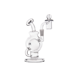 The MJ Arsenal Atlas Mini Dab Rig is a clear borosilicate glass rig featuring a spherical chamber, angled mouthpiece, flat circular base, and attached quartz banger with marble carb cap, shown on a white background.