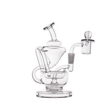 The MJ Arsenal Claude Mini Dab Rig is a clear glass piece with an intricate recycler design, multiple curved tubes, side handle, flat base, and angled mouthpiece—shown against a white background.