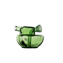 The MJ Arsenal Commander Blunt Bubbler is a modern, artistic green borosilicate glass bubbler with an abstract asymmetrical design and two angled openings, shown against a plain white background.