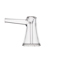 The MJ Arsenal Vulkan Bubbler, made of clear borosilicate glass with a cylindrical side spout and flared base, is shown against a plain white background.