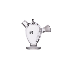 The MJ Arsenal The Martian® Original Blunt Bubbler™ is a clear glass piece shaped like a mini teapot or watering can with a spout, handle, and front logo, offering water filtration for smoother hits. Shown on a plain white background.