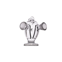 The MJ Arsenal Dubbler Original Double Bubbler is a clear borosilicate glass piece shaped like a fire hydrant with side nozzles and a top loop, shown on a white background—perfect as a unique blunt bubbler.