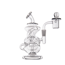 The MJ Arsenal Infinity Mini Dab Rig is a clear borosilicate glass recycler with intricate tubing, a wide base, and a side chamber with a rounded carb cap, shown on a plain white background.