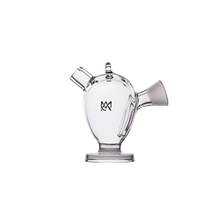The MJ Arsenal Martian Original Blunt Bubbler is a clear glass piece with three spouts, a round base, and a black abstract logo. Its unique design resembles a modern teapot or lab vessel, delivering smooth water filtration for your sessions.