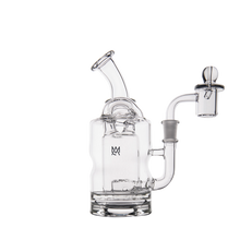 The MJ Arsenal Turbine Mini Dab Rig, made from clear borosilicate glass, features a curved mouthpiece, round base, cylindrical body, and a side Inception Turbine Perc attachment displayed against a plain white background.