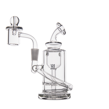 The MJ Arsenal Ursa Mini Dab Rig, made from borosilicate glass, features a cylindrical base, bent neck, and attached banger, shown on a plain white background.