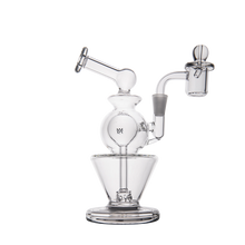 The MJ Arsenal Gemini Mini Dab Rig is a portable rig made from clear borosilicate glass, with a spherical chamber, angled mouthpiece, banger attachment, and cone-shaped base, shown in a crisp photo on a white background.