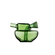 The MJ Arsenal Commander Blunt Bubbler is a modern green borosilicate glass piece with an abstract, sculptural design featuring two angled necks and curved geometric shapes, shown against a plain white background.