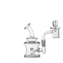 The MJ Arsenal Jammer Mini Dab Rig, featuring borosilicate glass, a bent mouthpiece, cylindrical chamber, attached banger, and dome carb cap, is shown against a plain white background.