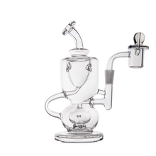The MJ Arsenal Titan Mini Dab Rig is a clear borosilicate glass piece with intricate curves and chambers, a side mouthpiece, and a right-side bowl attachment, all set against a plain white background.