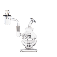 The MJ Arsenal Royale Mini Dab Rig is a clear borosilicate glass piece with a round base, bent neck, attached banger, and MJ logo on the body, shown photographed against a plain white background.