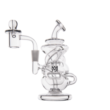 The MJ Arsenal Infinity Mini Dab Rig is a clear borosilicate glass rig with a complex twisted design, side mouthpiece, round base, and an overlapping M and W logo on the body.