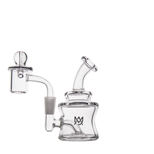 The MJ Arsenal Jammer Mini Dab Rig is a clear borosilicate glass pipe with a curved neck, chambered base, and attached bowl, featuring a black crown logo—perfect for stylish, portable dabbing. Displayed against a plain white background.