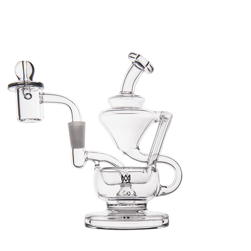 The MJ Arsenal Claude Mini Dab Rig is a clear glass recycler with a complex, artistic design featuring multiple chambers, curved tubes, and a small bowl attachment, shown against a white background.