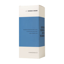 A white rectangular box with a blue center band displays "Human Grade Iridescent Zing Water Pipe," featuring a 14mm flower bowl and Human Grade branding at the top.