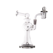 The MJ Arsenal Apollo Mini Dab Rig, crafted from clear borosilicate glass with a round base, curved neck, and attached bowl for optimal flavor, is shown against a plain white background.
