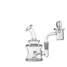 The MJ Arsenal Jammer Mini Dab Rig, a compact borosilicate glass piece with a curved mouthpiece, cylindrical chamber, quartz banger, and bubble carb cap, is displayed on a white background.