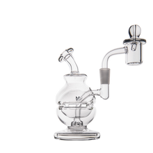 The MJ Arsenal Royale Mini Dab Rig, made from clear borosilicate glass, features a round base, angled mouthpiece, and side banger. Displayed on a white background.