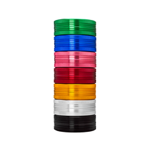 A vertical stack of ten colorful 2 Piece Flat Grinders—green, light blue, dark blue, red, pink, magenta, gold, orange, silver, and black—shown on a white background. Available in sets of 2 with multiple size options.