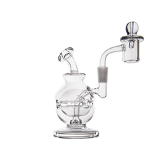 The MJ Arsenal Royale Mini Dab Rig is a clear borosilicate glass rig featuring a round base, angled mouthpiece, and right-side bowl, designed for smoking or vaporizing.