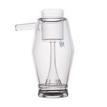 The MJ Arsenal Proxy Bubbler is a clear borosilicate glass dabbing accessory with a left-side cylindrical spout and internal glass element, shown against a plain white background.