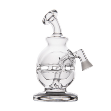 The MJ Arsenal Royale Vape Edition is a clear glass dab rig featuring a rounded base, angled mouthpiece, and side joint for a bowl or banger, shown against a plain white background.