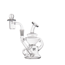 The MJ Arsenal Hydra Mini Dab Rig is a clear glass piece with a round chamber, angled mouthpiece, and removable glass nail, shown on a white background.