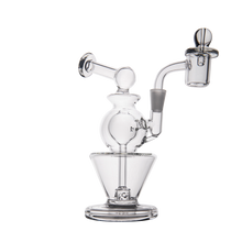 The MJ Arsenal Gemini Mini Dab Rig is a compact rig made from durable borosilicate glass, featuring a cylindrical base, curved neck, spherical midsection, and a quartz banger for efficient concentrate vaporization.