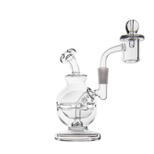 The MJ Arsenal Royale Mini Dab Rig, made of clear borosilicate glass with a round chamber, angled mouthpiece, and attached bowl, is displayed on a white background.