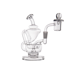The MJ Arsenal Claude Mini Dab Rig is a clear glass recycler with multiple chambers and curved tubes, featuring a domed top and side arm with cylindrical attachment, shown against a white background.