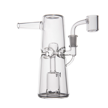 The MJ Arsenal Turret Mini Dab Rig, made of clear borosilicate glass with a cylindrical base, angled mouthpiece, percolator, and quartz banger for concentrates, is shown on a white background.